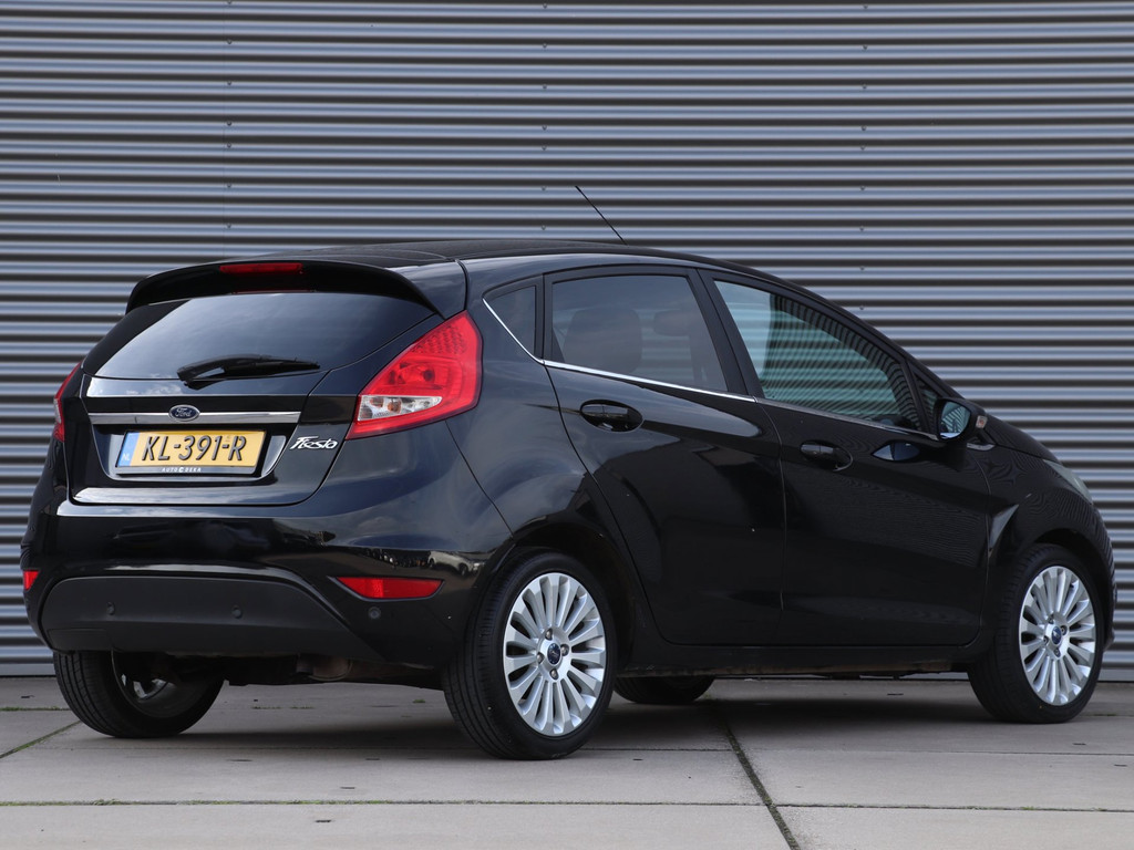 Ford Fiesta 1.25 Titanium *Klimaatreg.*Parkeersens.* 57097472-1.jpg | Autodeka.nl
